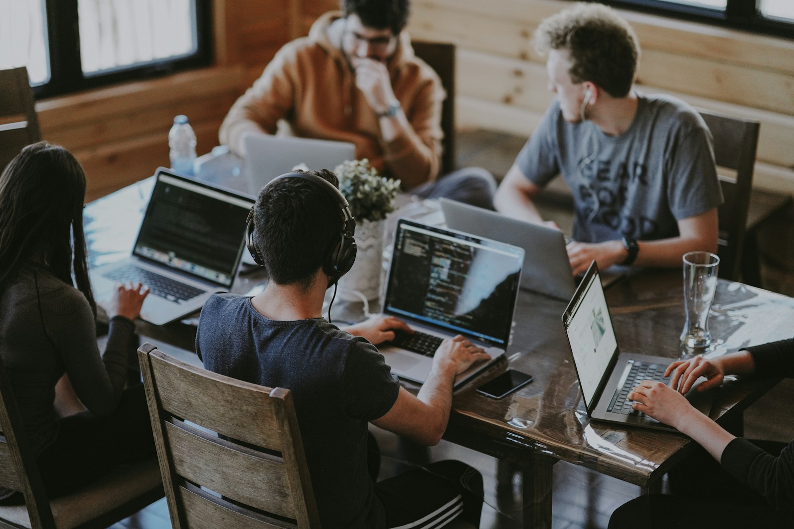 Engineering team collaborating around a table in a modern office